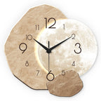Decorative wall clock with stone design and moon background