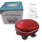 Red smart scalp massager with packaging and instruction manual on a white background