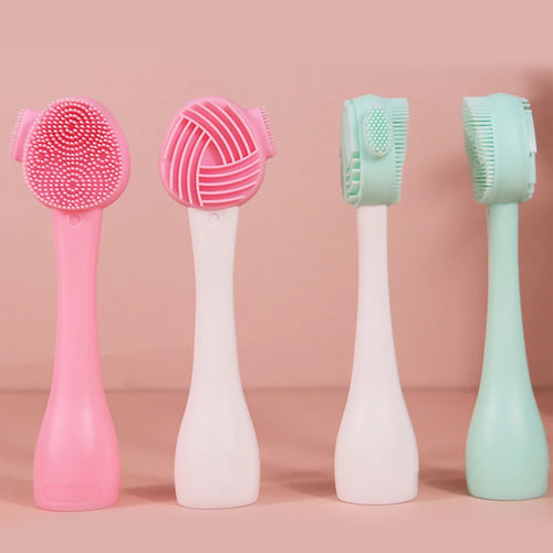 Four different heads of a facial cleansing brush on a pink background