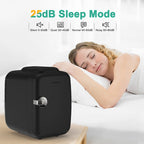 Woman sleeping with a black noise machine labeled '25dB Sleep Mode' on a white background