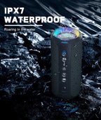 Waterproof portable speaker with IPX7 rating on a rocky surface with water.