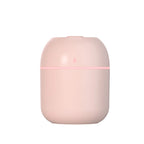 Pink air freshener with a light on a white background