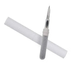 White calligraphy pen with a gray grip on a white background