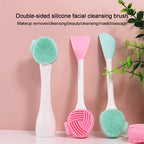 Double-sided silicone facial cleansing brush with green and pink bristles on a pink background.