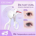Electric eyelash curler with temperature controls on a purple background