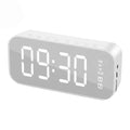 Digital clock with LED display on a white background