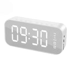 Digital clock with LED display on a white background