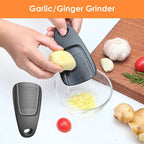 Garlic/Ginger Grinder being used with garlic and ginger on a cutting board.