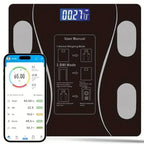 Digital body fat scale with smartphone app interface and user manual on a white background