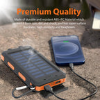 Orange and black solar-powered phone charger on a concrete surface with text about its durability.