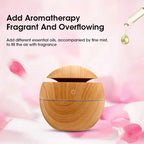 Wooden diffuser with essential oil droplet and text on a pink floral background