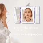 Woman using a compact mirror with a telescoping shoring column on a light gray background.
