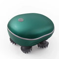 Green handheld massager with brush heads on a white background