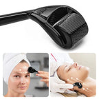 Black facial roller device with close-up images of a woman using it on her face.
