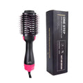 One-Step hair dryer and styler with pink accents next to its packaging on a white background