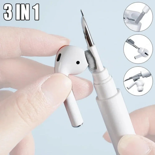 3-in-1 pen with different tips held by a hand against a light blue background