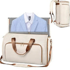 White duffel bag with brown leather straps, light blue blazer, and white shirt inside, beige backpack on white background