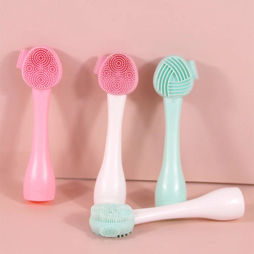 Two pink and two green cleaning brushes on a pink background